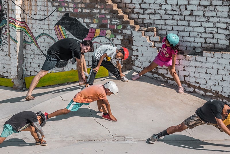 Group picture of Peru skateboarders stretching