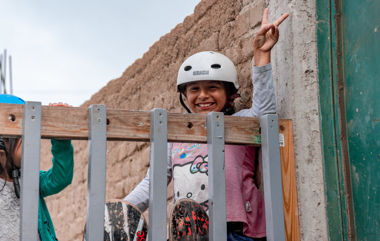 Skateboarding girl with a big smile at the Cerrito's Skatepark in Peru.