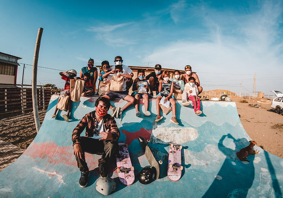 Group of Peruvian skateboarders on a miniramp