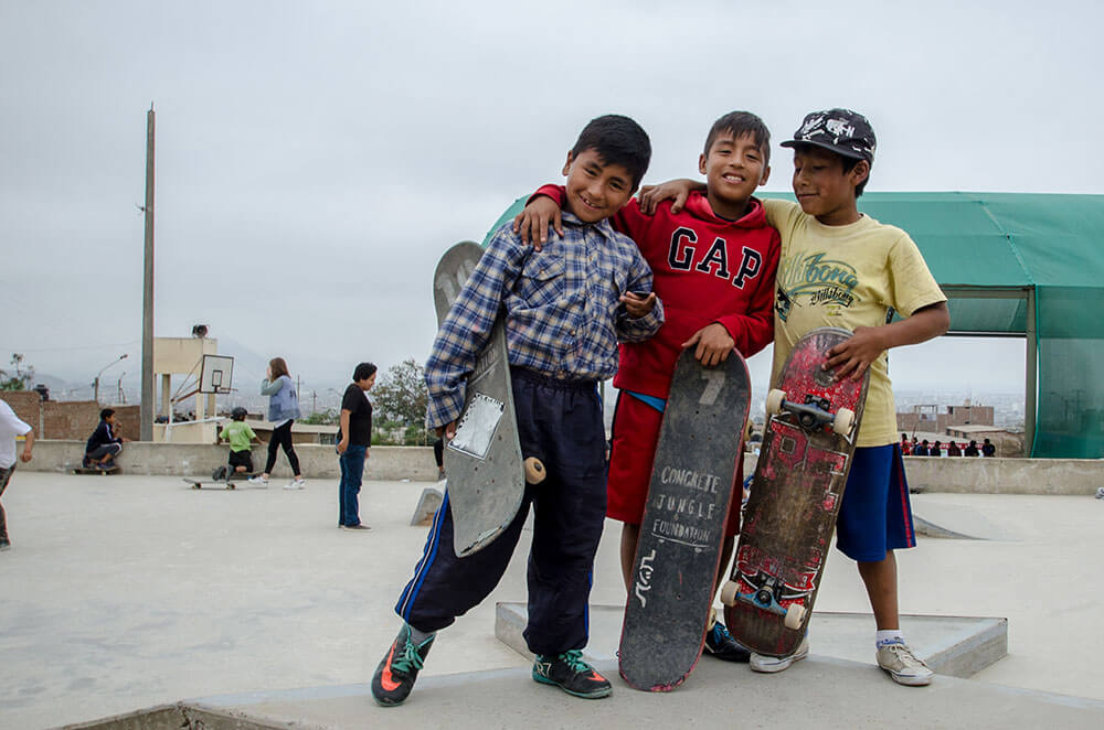Three kids having fun on skateboard at the Alto Trujillo Skatepark
