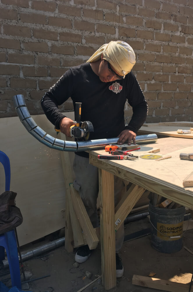 Jhikson making the rainbow rail for La Rampa skatepark in Peru