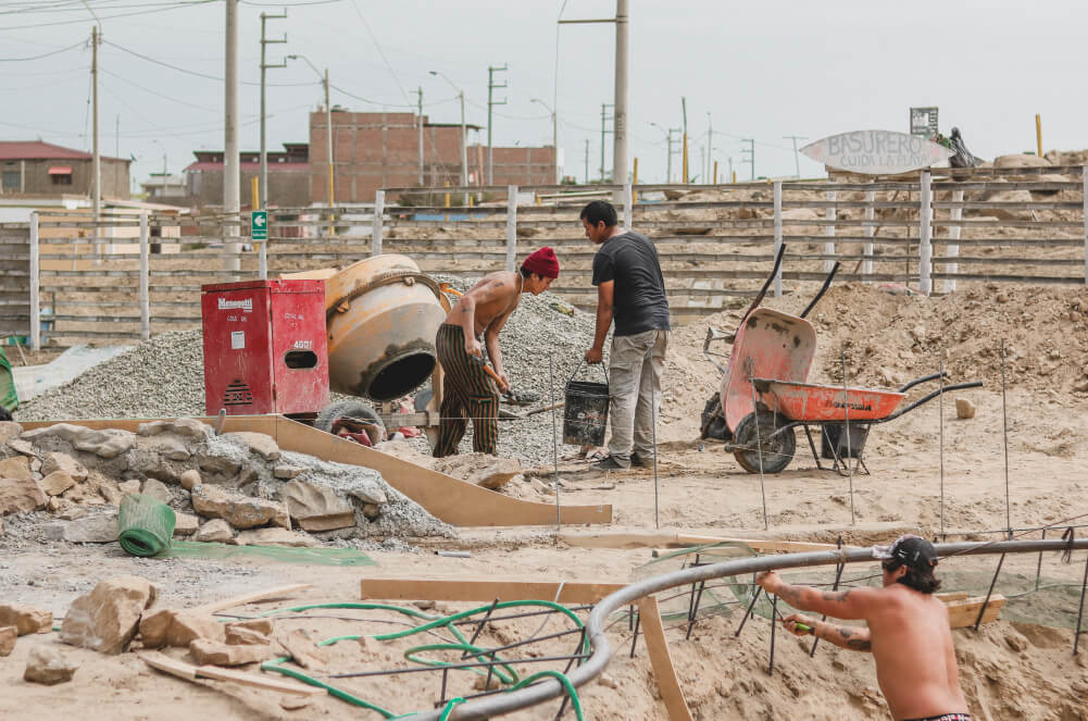 Jhikson mixing concrete in Lobitos, Peru