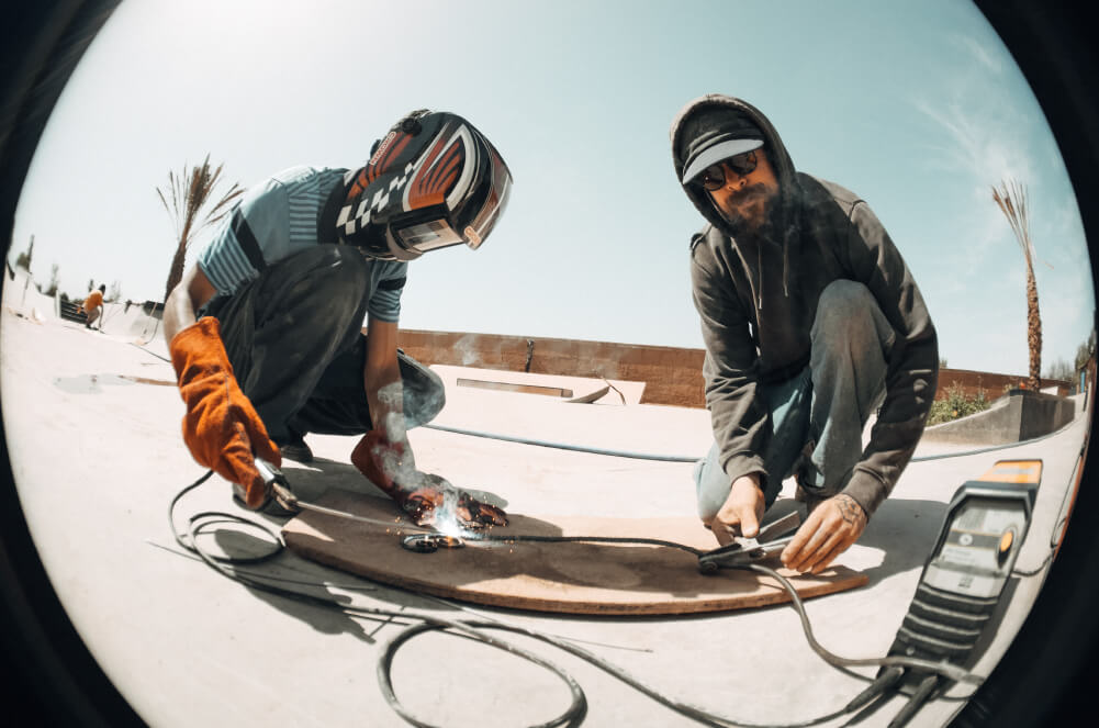 Teacher explaining how to weld safely at Fiers et Forts Skatepark in Morocco