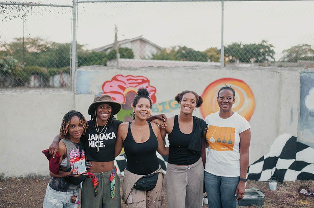 Group pictures of female skateboarders at the Freedom Skatepark in Jamaica.