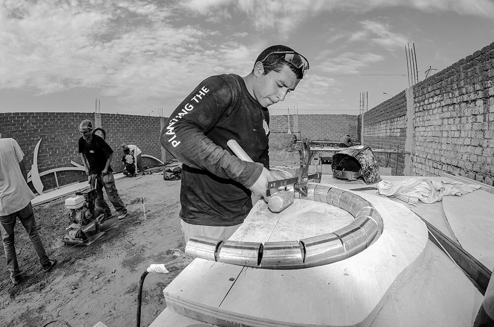 Jhikson Akamine from CJF Peru learning welding during the construction of the Cerrito's skatepark in Trujillo, Peru