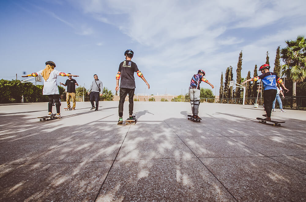 Children skateboarding in Tamesloht, Morocco