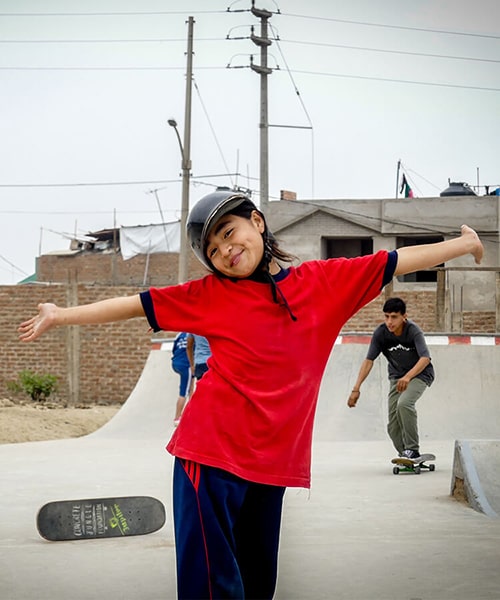 Girl skateboarding in Peru during an Edu-Skate class